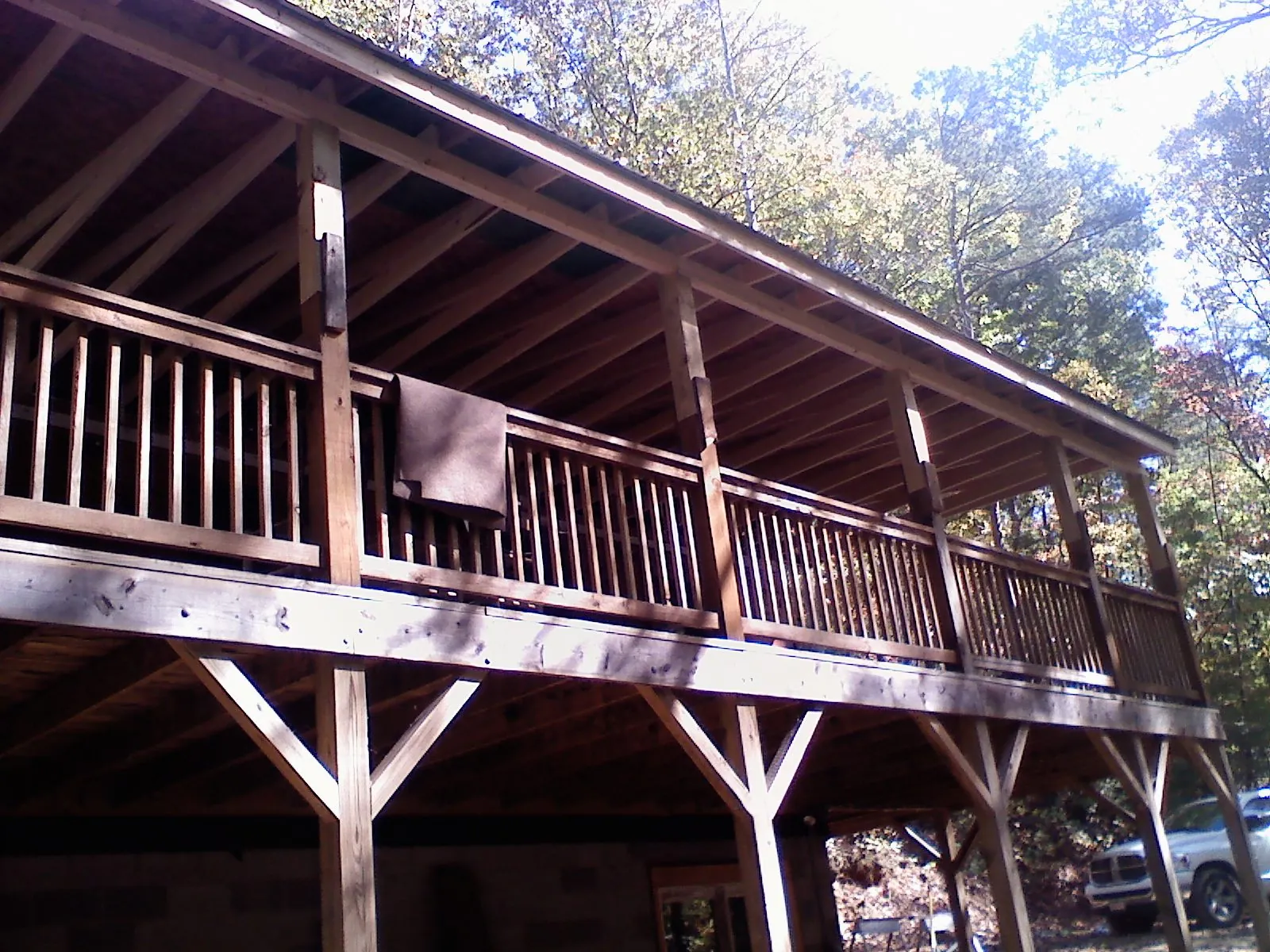 Timber framing under a new elevated porch and deck — Roof Leak Repair in Twin Mountain by Roofing Brothers
